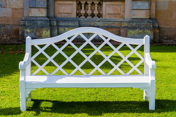 White wooden bench in countryside English park