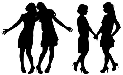 silhouette of two young slender women