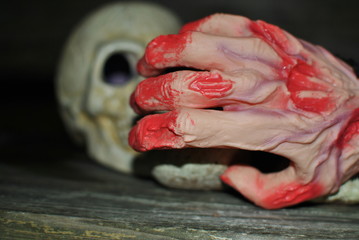 scary hand covered in blood