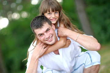 portrait of a happy family in summer nature