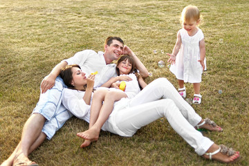 portrait of a happy family in summer nature