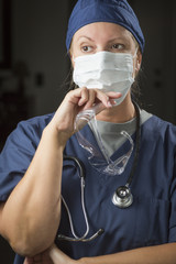 Female Doctor or Nurse Wearing Protective Face Mask