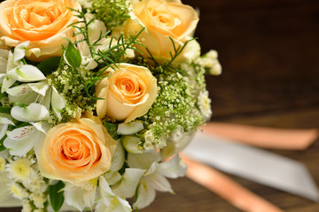 Beautiful bouquet of flowers on wooden background