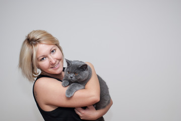 Woman holding a male cat
