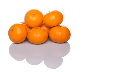 A group of Mandarin orange fruit over white background