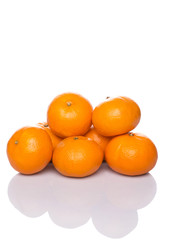 A group of Mandarin orange fruit over white background
