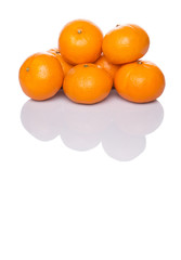 A group of Mandarin orange fruit over white background