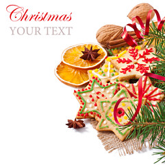 Christmas cookies, spices and spruce branches isolated on white 
