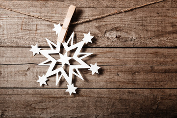 Snowflakes border on grunge wooden background