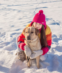 Girl with her dog resting outdoors