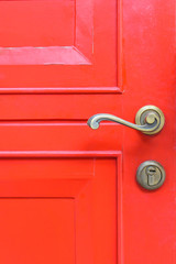 classic door handle on red door