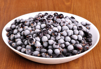 heap of frozen black currant in a plate