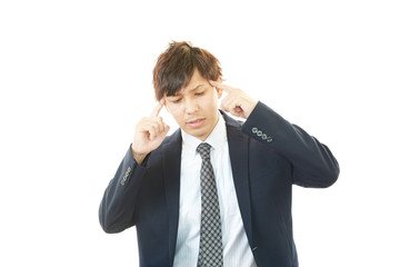 頭痛を訴えるビジネスマン