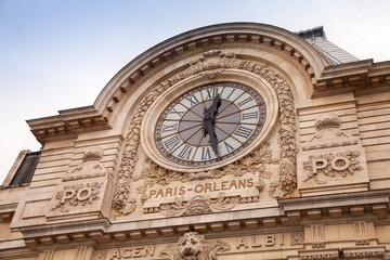 Ancient clock on the wall of Orsay Museum in Paris