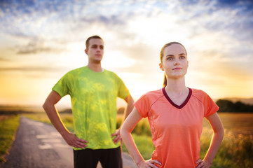 Couple running at sunset