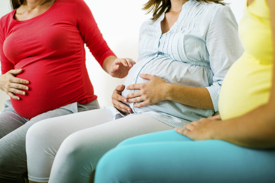 Pregnant Women On Sofa