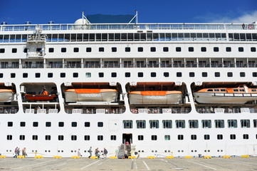 Cruise ship in port, passenger boarding