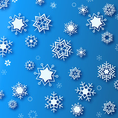 Wintertime - blue background with white beautiful snowflakes