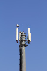 Fototapeta na wymiar Mobile antenna against blue sky