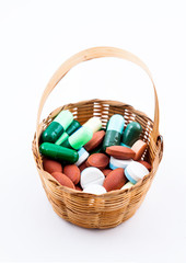 Tablet of medicine in small wicker basket