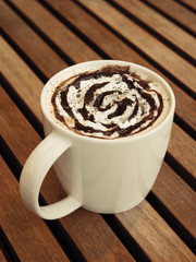 Hot vanilla latte with vintage filtered effect