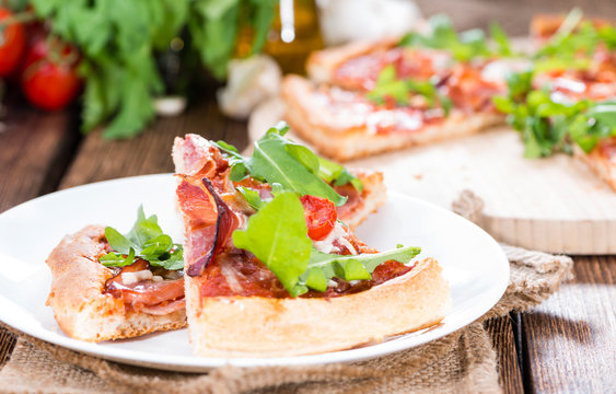 Ham Pizza with rocket and fresh tomatoes