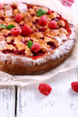 Tasty cake with berries on table close-up