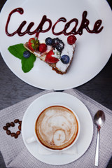 Cup of coffee with cute drawing in cafe
