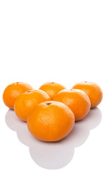 A group of Mandarin orange fruit over white background