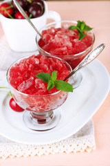 Closeup of cherry granita in glass bowls,