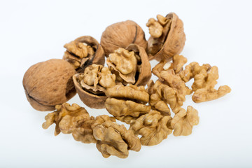 walnut and a cracked walnut isolated on the white background