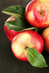 Ripe apples on wooden background