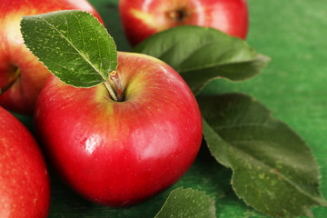 Ripe apples on wooden background