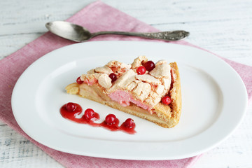Piece of tasty pie with apples and berry mousse,