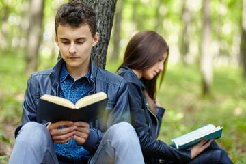 Teenagers studying together outdoor