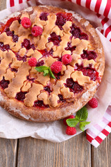 Tasty cake with berries on table close-up
