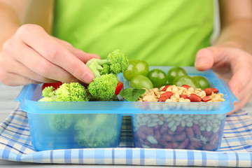 Woman making tasty vegetarian lunch, close up