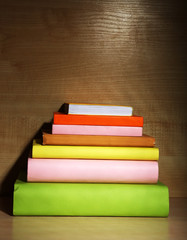 Books on wooden shelf close-up