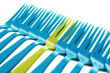 Individuality concept. Plastic disposable tableware, close-up