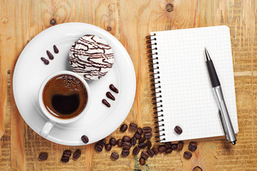 Coffee with tasty cookies and notebook