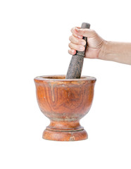 Mortar and pestle on isolated white background with hand