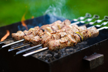 Juicy slices of meat prepare on fire