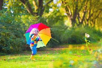 Adorable little girl with umbrella