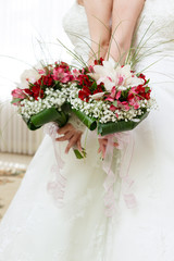 beautiful bridal bouquet of lilies and roses at a wedding party