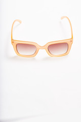 Sunglasses on white background, space for text