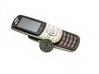 Old cell phone ruined and scratchy and norwegian currency