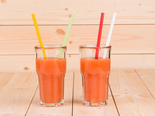 Glasses full of tasty fresh grapefruit juice.