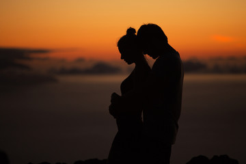 Silhouettes of the young couple - 71792876