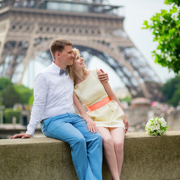 Just married couple hugging near the Eiffel tower