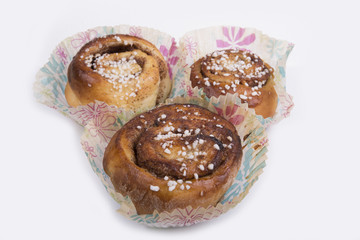 Close up of a cinnamon bun in a studio (background, wallpaper)
